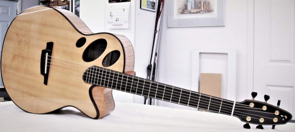 Oracle 16 Acoustic guitar.  Salmon Trap Sitka Spruce with curly Maple.